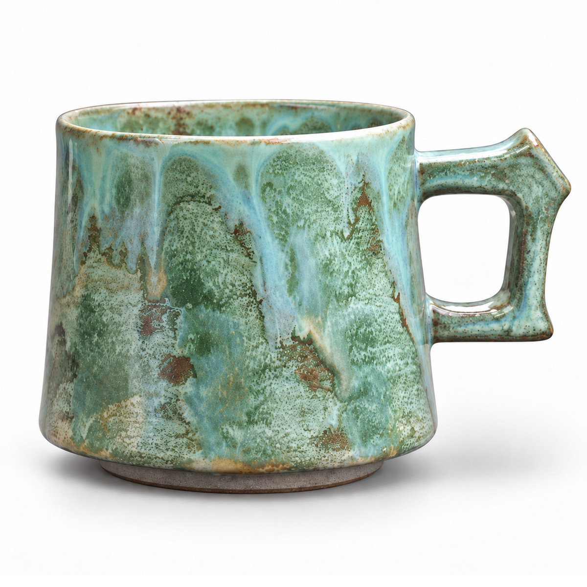 Green ceramic mug, white studio background, aligned with the blue and pink mugs